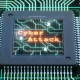 Microchip Close-up With Cyber-Attack Message