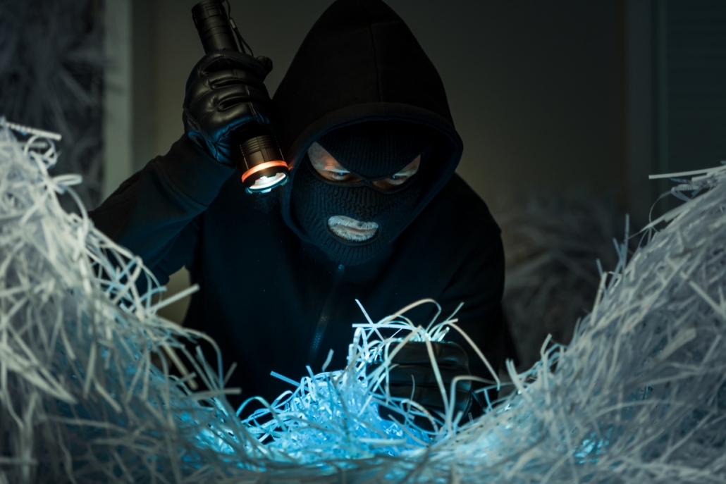 Spy stealing important information from shredded documents