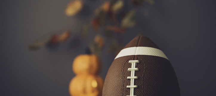 American Football with fall leaves and pumpkins. Football Season
